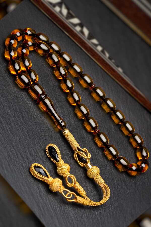 Gold Plated Silver Kazaz Tasseled 8x12mm Capsule Cut Fire Amber Rosary